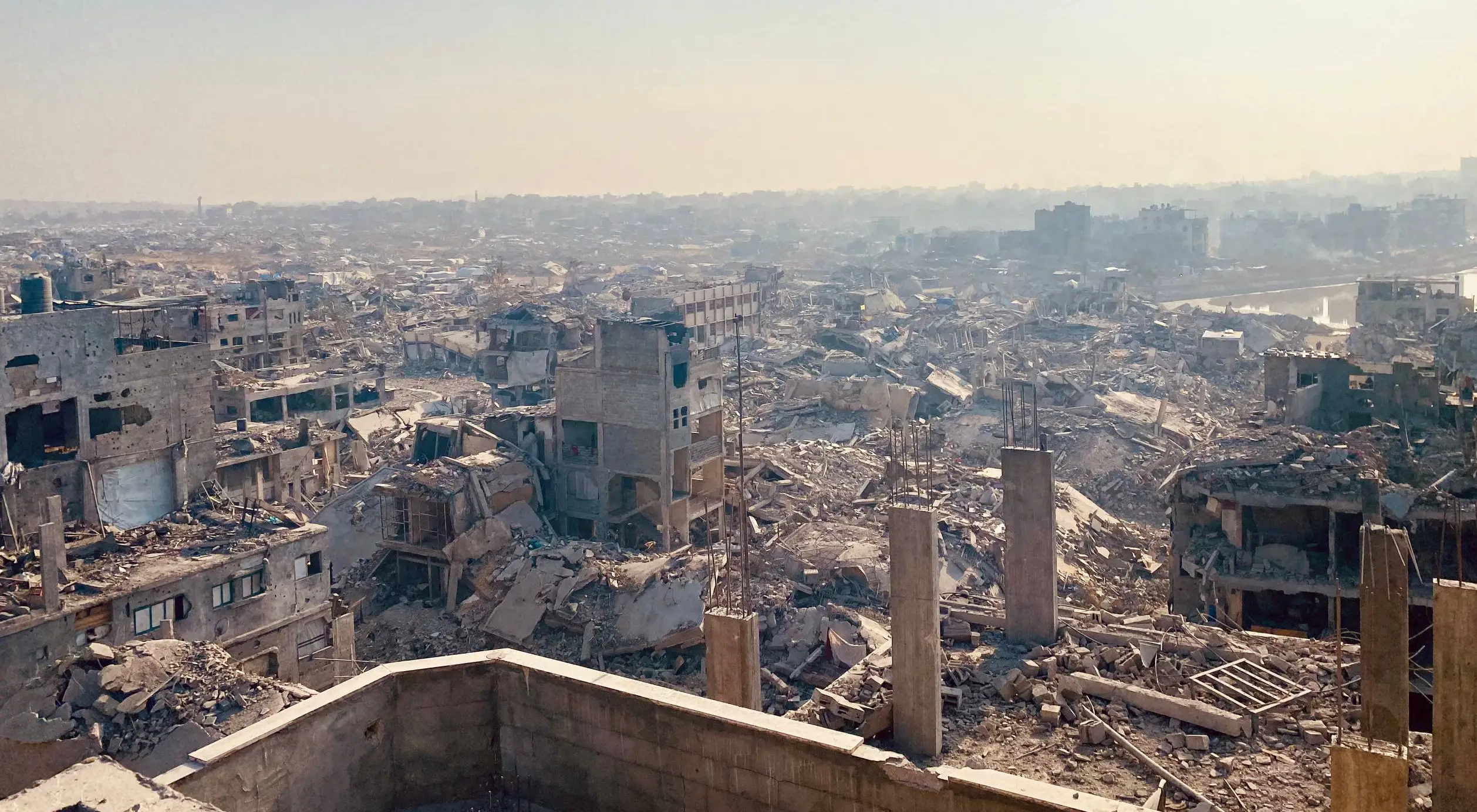 Tents in Gaza refugee camp with rainbow overhead - living conditions after displacement